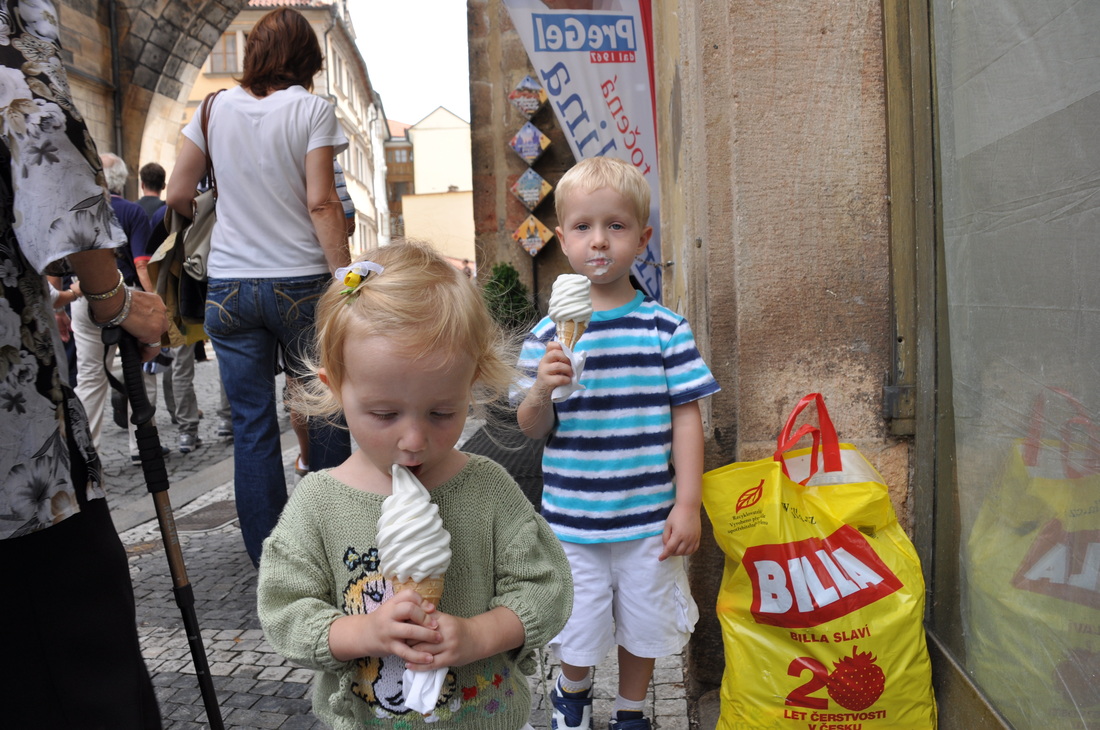 The kids enjoying their dairy treat on the Charles Bridge